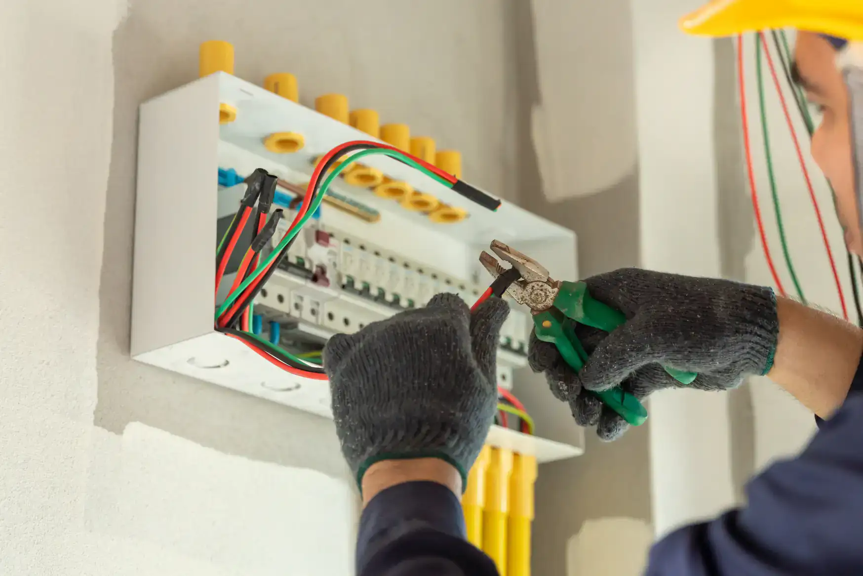 Professional electrician upgrading an electric panel with new wiring in Chicago, IL, ensuring safety and efficiency for residential and commercial properties